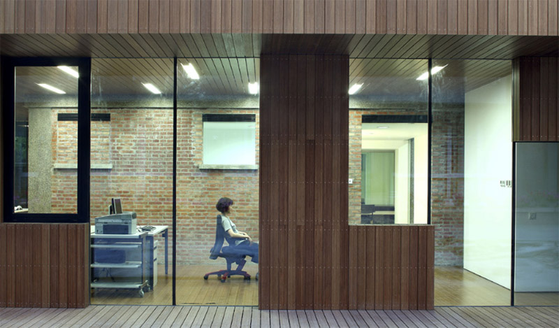 Modern office facade with stained bamboo siding