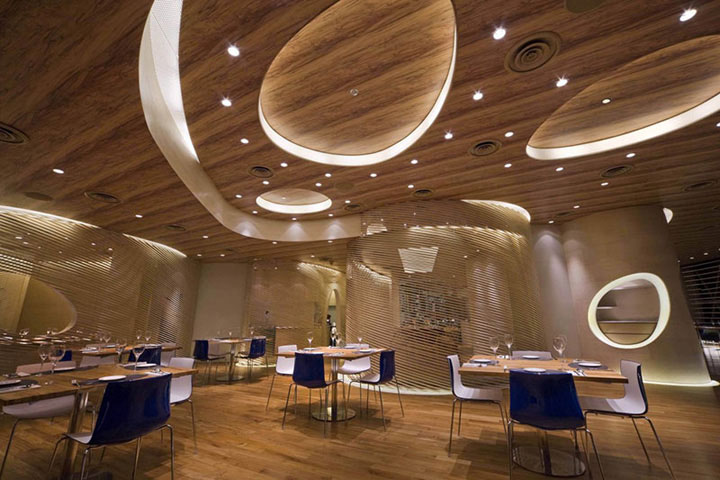 Large oval ceiling cutouts evoke the look of an underwater cavern