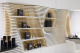 Stacked shelves line the walls in cosmetics store interior design