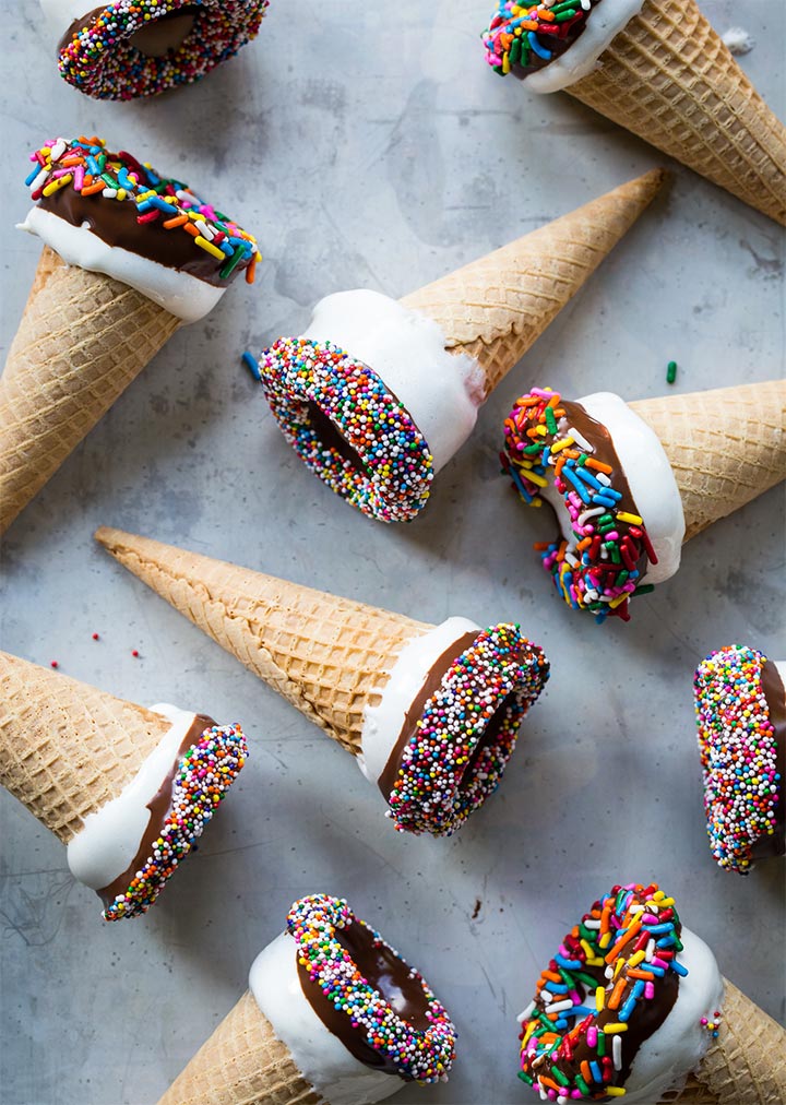 Cones dipped in icing and sprinkles