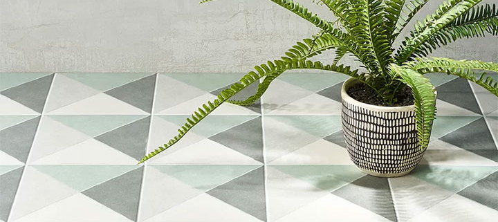 Sage patterned floor tile with green plant