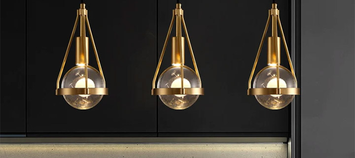 Elegant gold-frame lighting in restaurant design