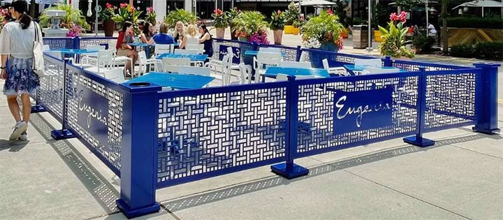 Blue branded stands and panels around an outdoor area