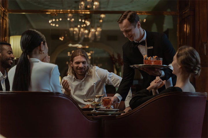Customers having fun in a restaurant and enjoying a great experience