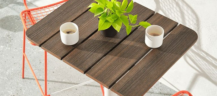 Creative table design with slanted tabletop and stable steel frame