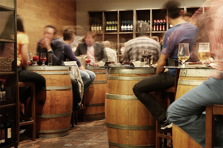 Barrel-shaped tables in a charming bar.