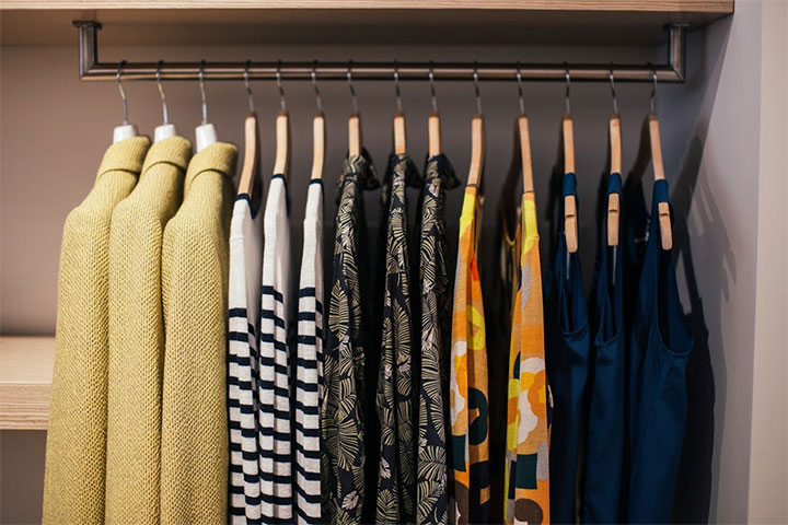 Metal rack for clothing in boutique store.