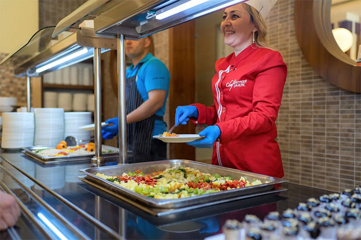 Self-serve buffet with stainless steel structure.