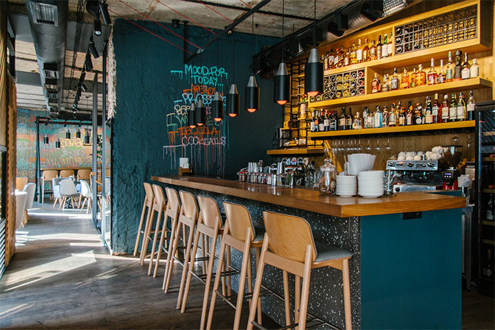 Wooden counter in the bar area of a restaurant.