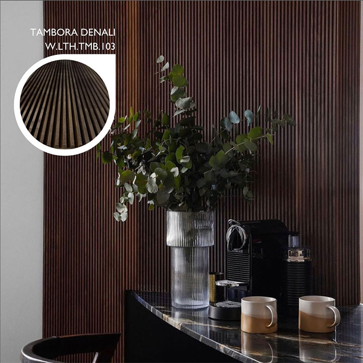 Rich-colored wall panels made of wood sheets as a backdrop for a cafe counter.