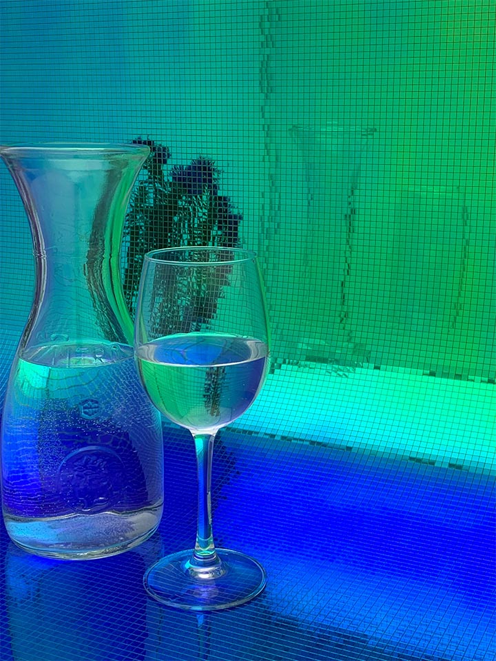 Bar counter design with blue-and-green flexible reflective panels.