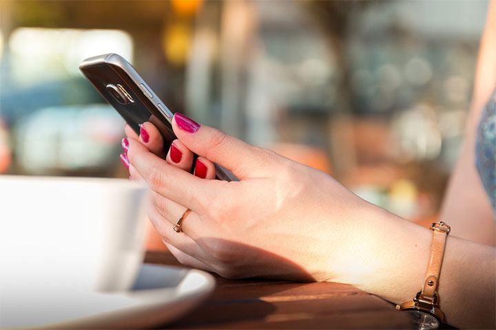 Woman looking on a phone at an optimized website.