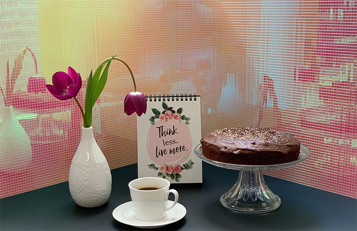 Pink-and-yellow reflective wall panels used in the design of a dessert shop.