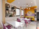 Boba tea cafe with bookshelf.