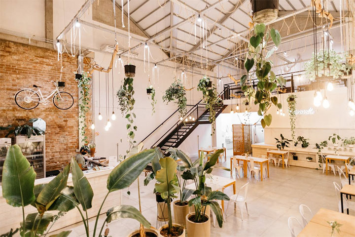 Urban restaurant ambiance created by minimalistic design and bycicle-themed decor.