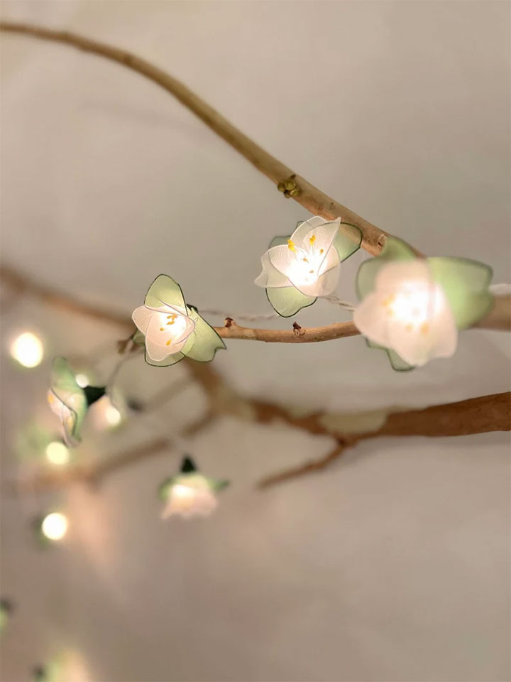 Floral string lights in pastel colors for dessert shop springtime seasonal decor.