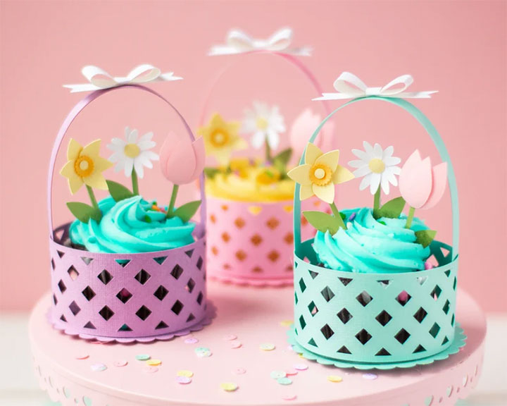 Spring-inspired cupcake wrappers in pink, purple and mint green.