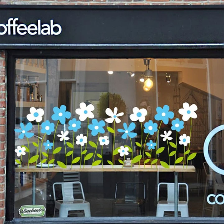 Floral window clings in coffee shop.