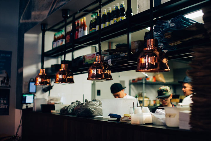 Elegant copper light fixtures in a sophisticated restaurant.