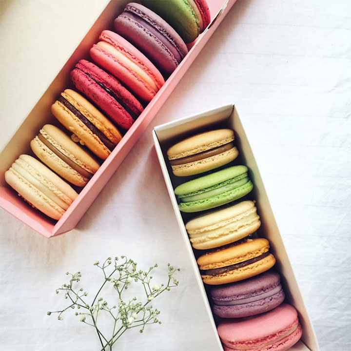 Colorful stock image of colorful macaroons in boxes.