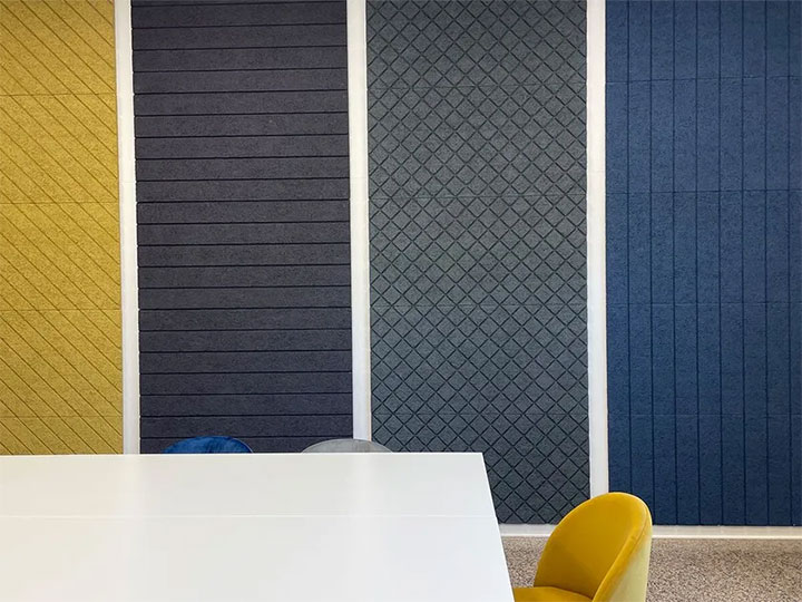 Samples of colorful sound-absorbing ceiling panels.