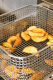 Golden fries being cooked.
