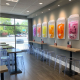 Boba tea shop boasting acrylic chairs and other affordable commercial furniture.