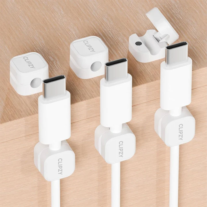Cable clips and holders attached to the back of the desk.