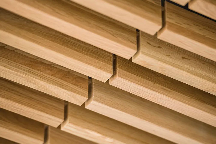 Close-up of wood-slat ceiling.