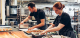 Two chefs working in a kitchen.