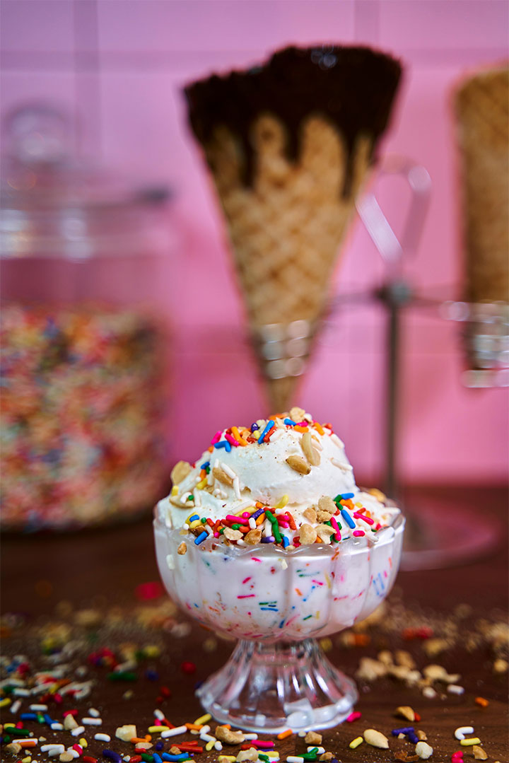 Ice cream in a glass, with different toppings.