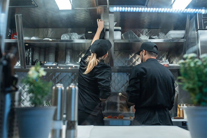 Kitchen restaurant design with vertical shelving.
