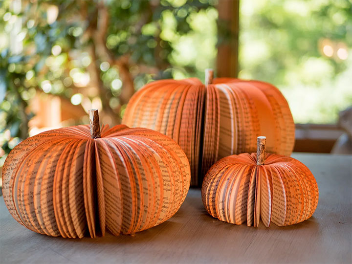 Orange pumpkins made of book pages.