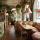 Eclectic furniture in pastel-toned restaurant design.