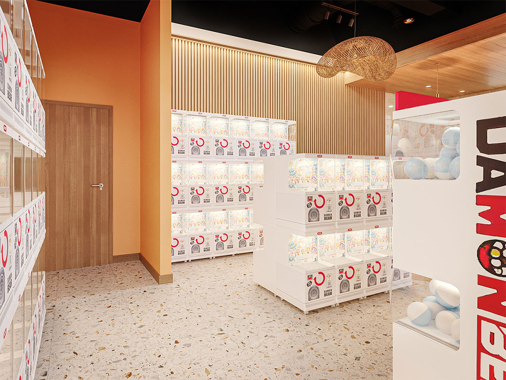 Corner with Gashapon toy vending machines in a dessert shop.