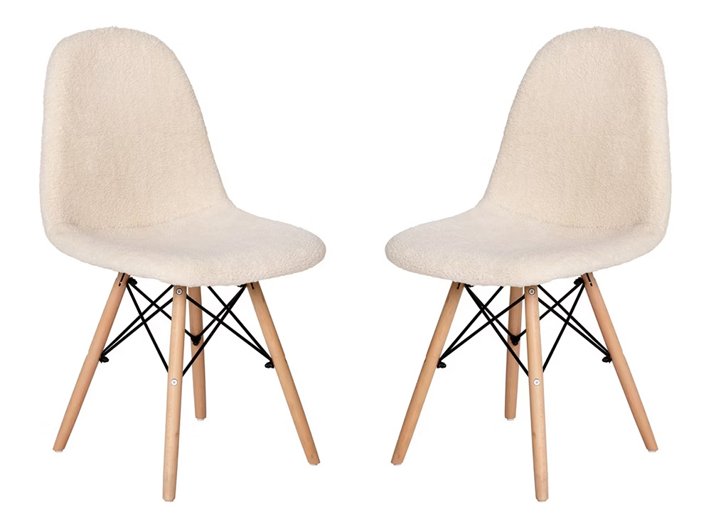 Off-white padded chairs with wooden legs.