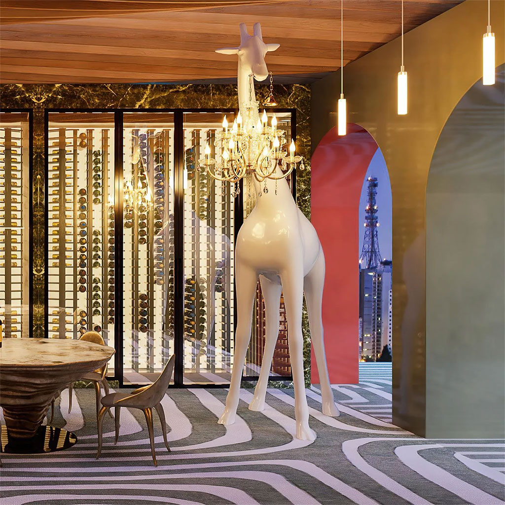 Dramatic giraffe sculpture holding a chandelier, for opulent restaurant and retail lighting.